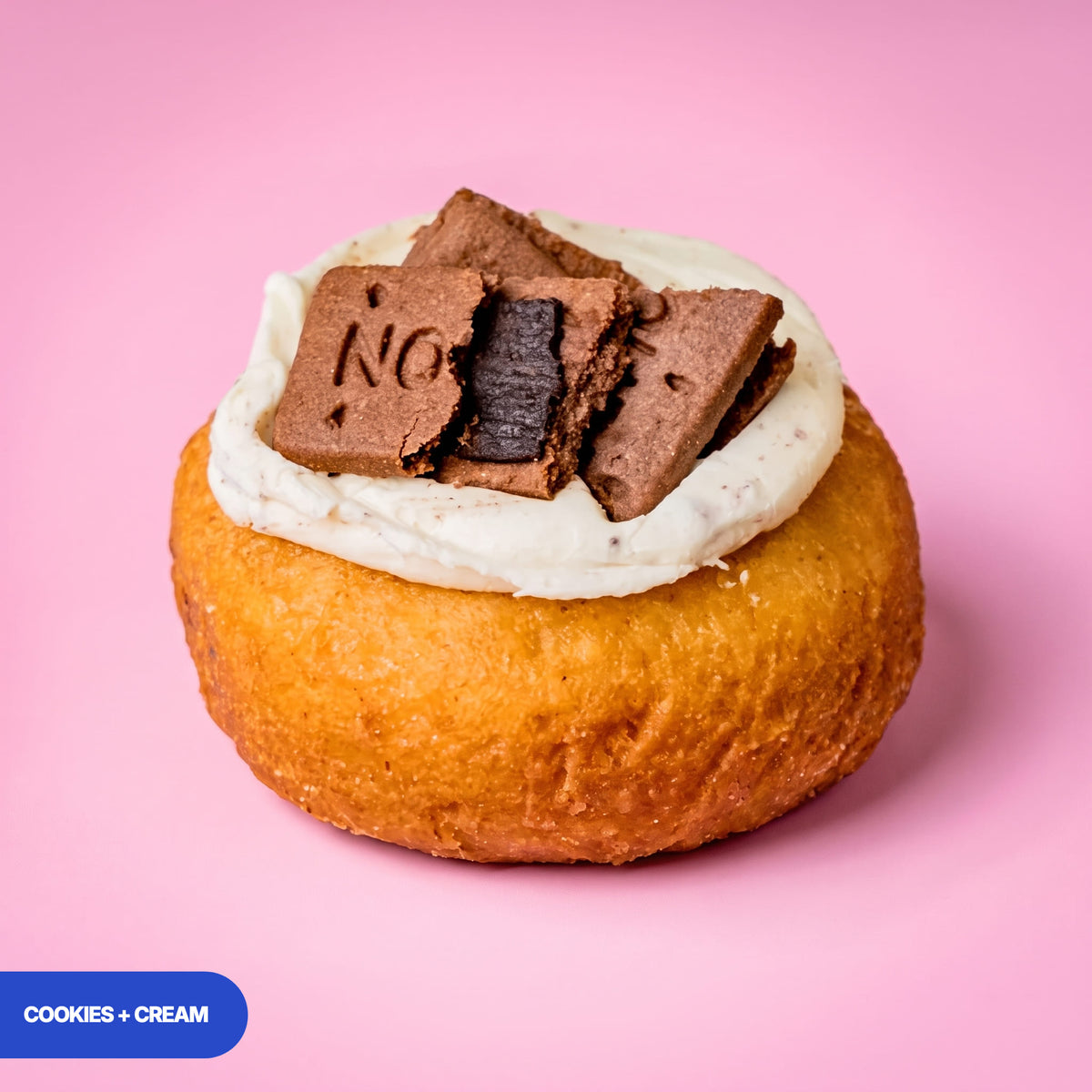 Gluten free oat free vegan fried cookies and cream doughnut, vanilla cream topped with chocolate biscuit pieces